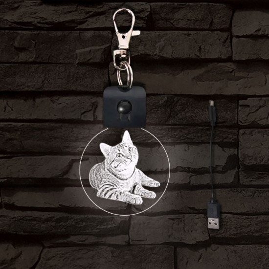 Fekvő cica világító LED-s kör kulcstartó