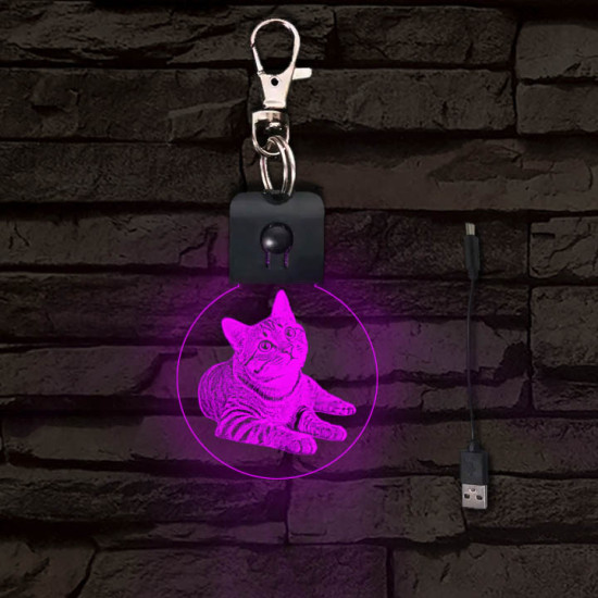 Fekvő cica világító LED-s kör kulcstartó
