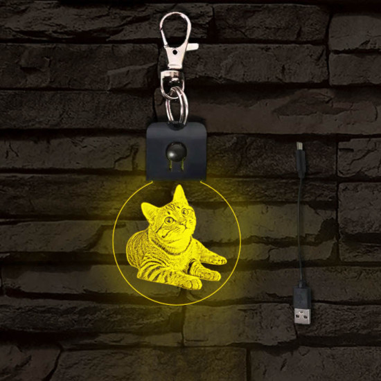 Fekvő cica világító LED-s kör kulcstartó